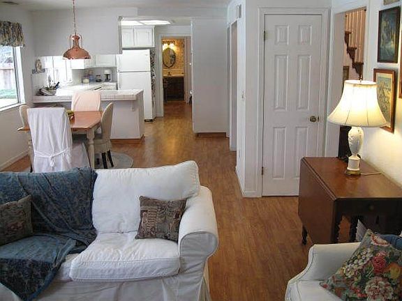 View from Family room through kitchen, utility room & downstairs bath.