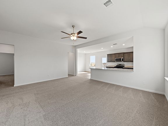 The family room sits adjacent to the kitchen and dining room.