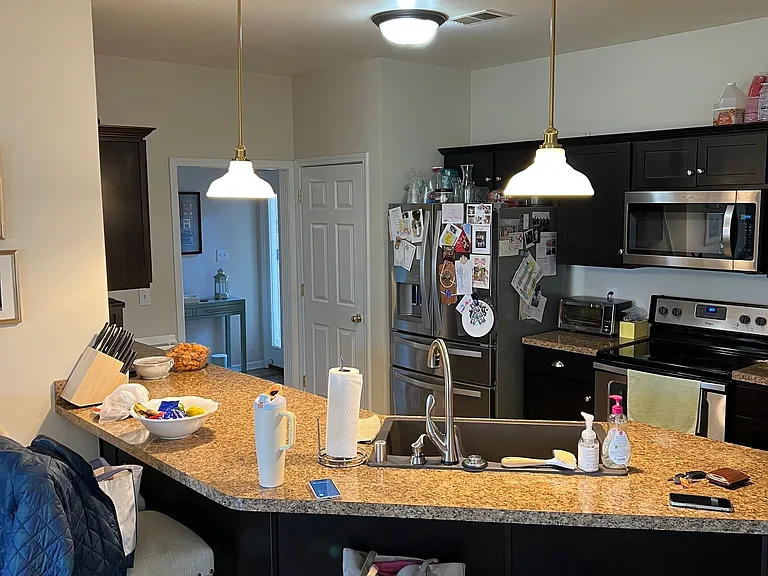 Kitchen with view of foyer.