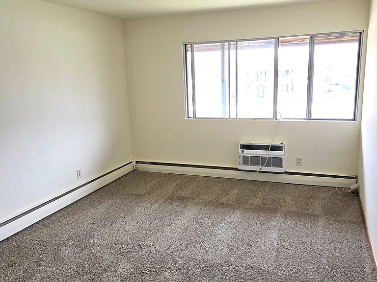 Living room, includes an air conditioner.