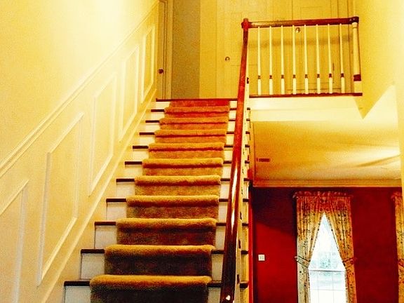 stairs to 2nd floor bedrooms and game room