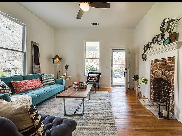 Bedroom in front of house. It is to the right of fireplace. There is another fireplace on the other side. Fireplaces are not operational.