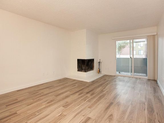 Two Bedroom Living Room With Decorative Fireplace