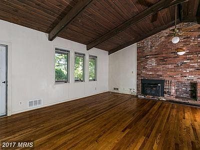 Cathedral ceiling, refinished wood floor & with fire place.