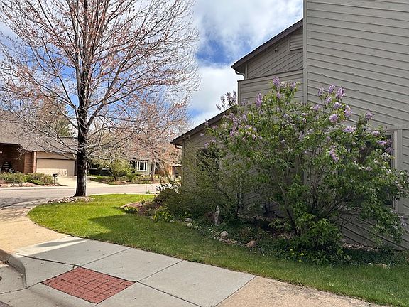 Side of house showing landscaping that is cared for by a local company and is included in the rental cost.