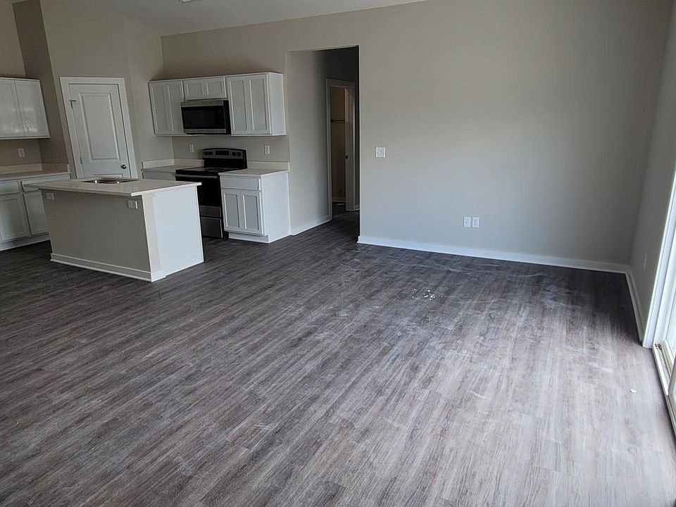 Large open concept living room, kitchen, and dining