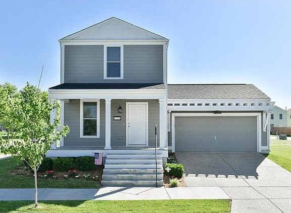 A traditional front entrance with a driveway is a unique to New Town. Look at the beautiful arbor ov