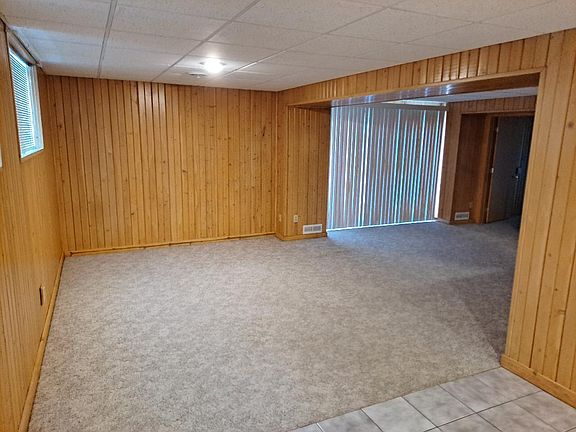 Another view of the large living room.Patio door leads to huge paver brick patio and a beautiful view.