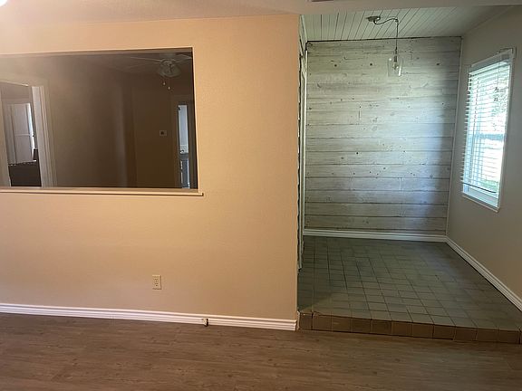 Landing pad off of living room leading into dining room