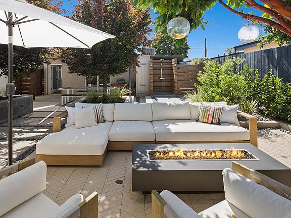 Seating area and outdoor shower in the background