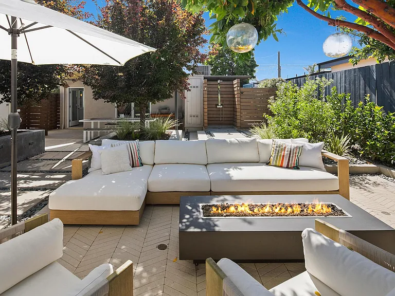 Seating area and outdoor shower in the background