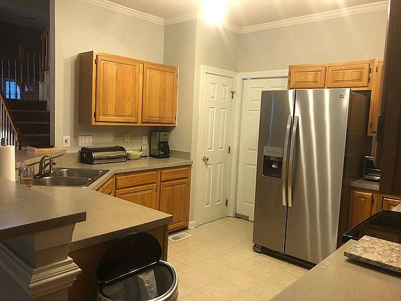 Kitchen with new stainless steel appliances in August 2019
