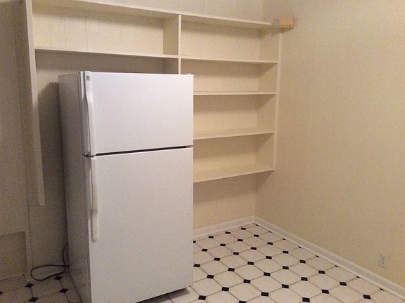 Built in shelving around refrigerator.
