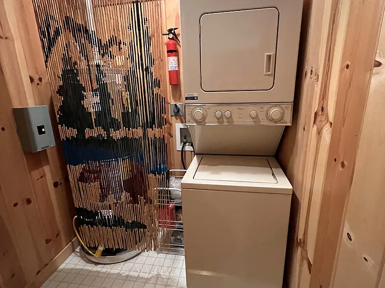 Laundry room with small washer and dryer