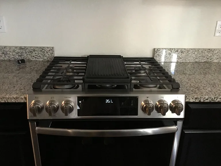Upgraded Gas with griddle top, self cleaning convection oven