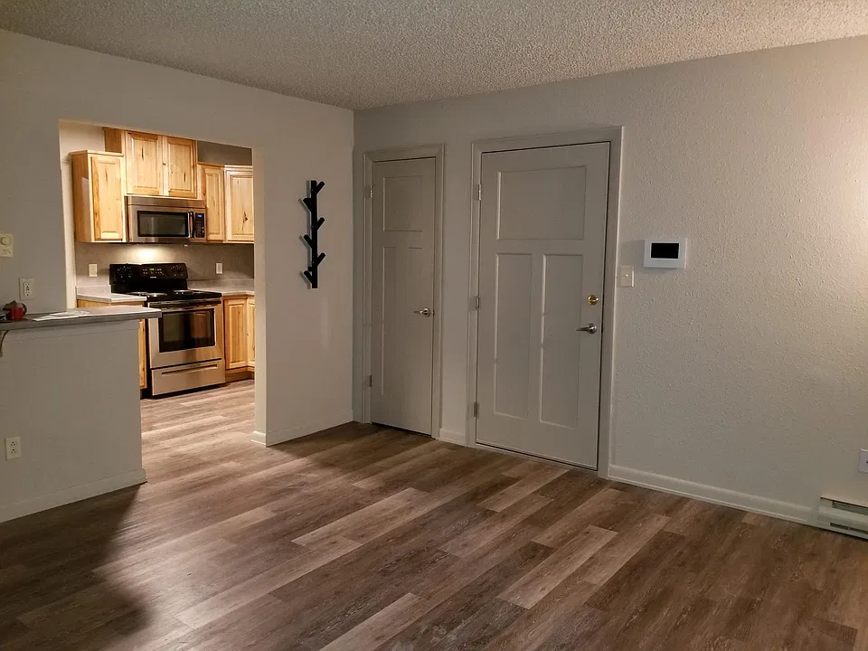 From Living room looking at front door & kitchen