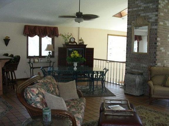 View of living and dining from front door area