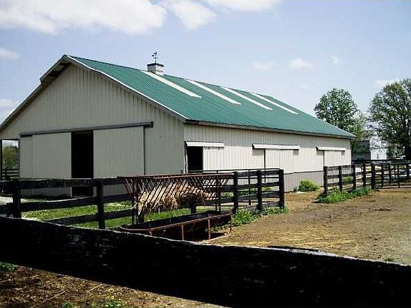 1800 sq ft pole barn, sliding doors lead to paddocks