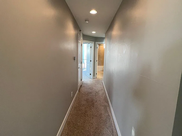 Laundry room between master bedroom and guest room.