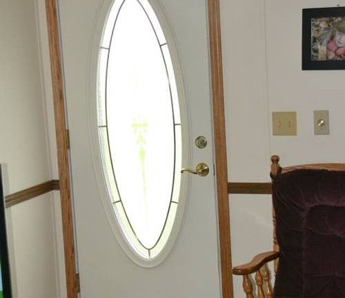 The front entrance opens into the living room area, which is the center of the home. Easy access to all of the rooms in the home from this location.