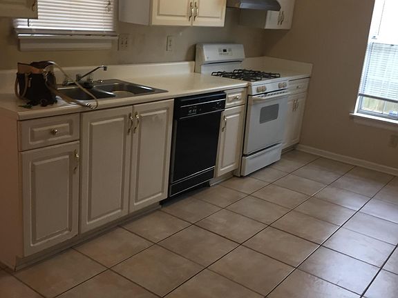 Bright kitchen looking out to back yard