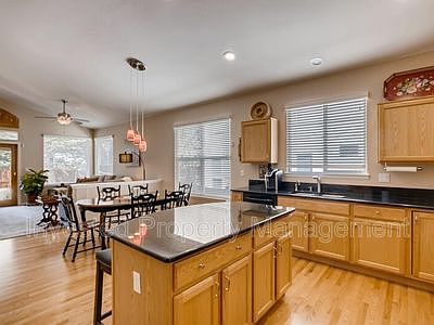 Kitchen has island, two seats, large pantry and dining area