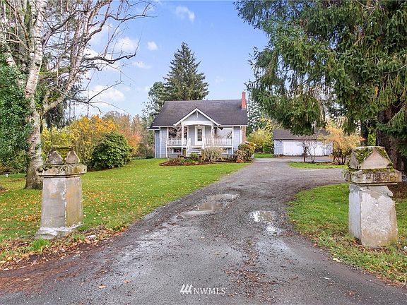 Long driveway off the road, extra parking to the right.