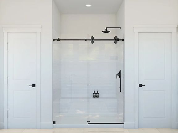 Primary bath with glass shower enclosure