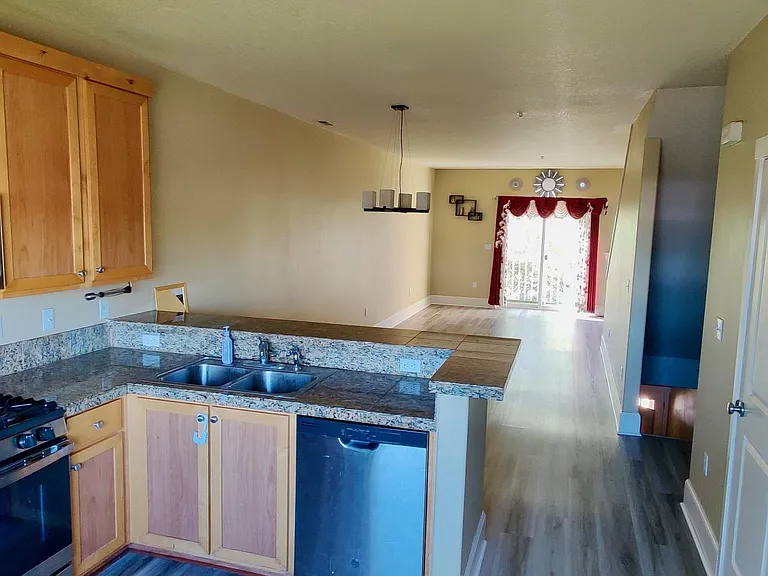 Kitchen, dining, and living room view.