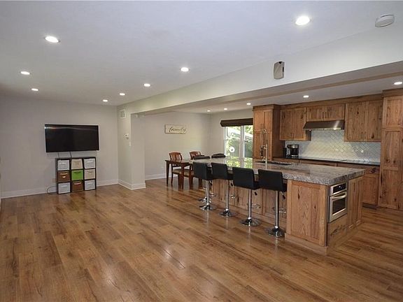 Custom solid hickory cabinetry sets the tone for this gourmet kitchen.