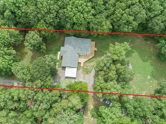 Property outlined in red. Left side of picture is road frontage.