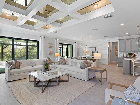Connected living space with bright windows, perfect feature in a new construction home