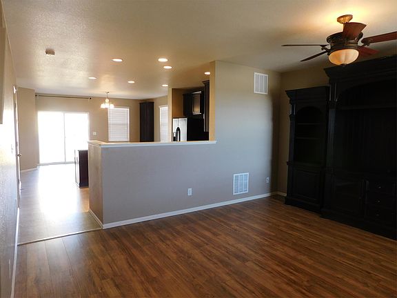 View of living room open to kitchen and dining room