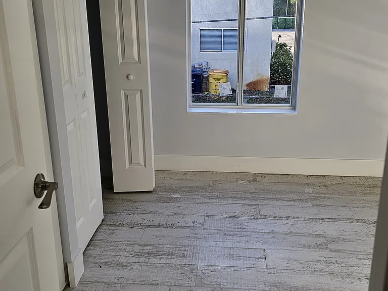 This upstairs bedroom has a super tall window.