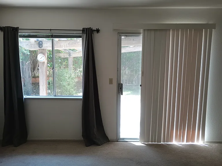 Master bedroom sliding glass door to backyard