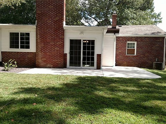 Rear of house shows the large patio area.
