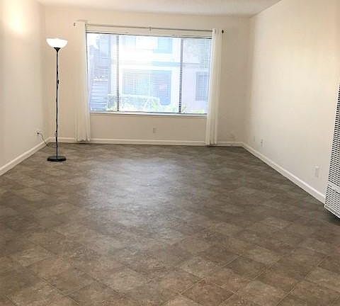 Living room with sheers and mini-blinds open