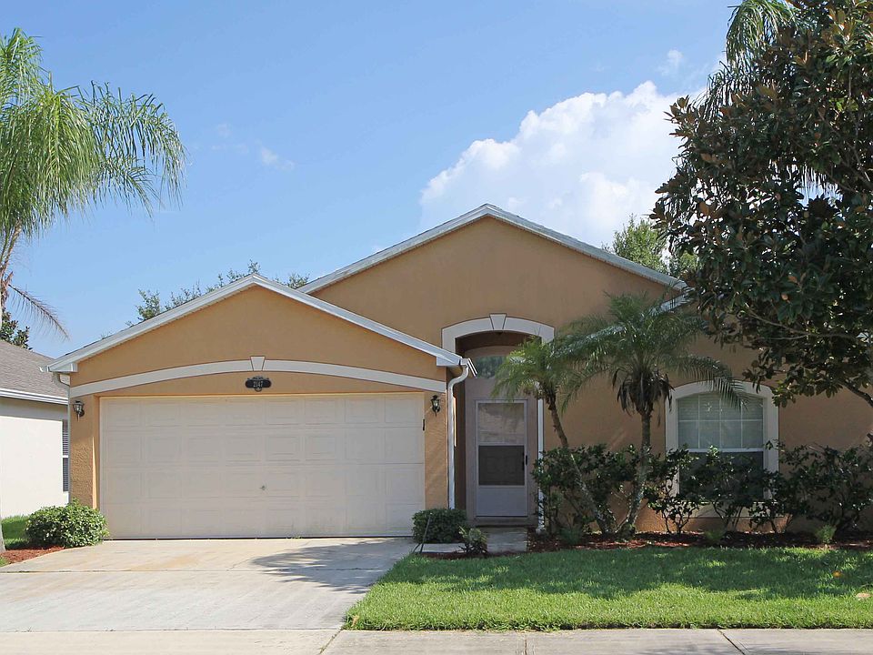 Front view - home has been painted a lighter beige color since this photo.