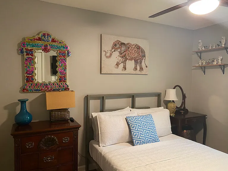 2nd Guest Bedroom/ Office with modern ceiling remote controlled fan with large window, adjustable, faux wood window blinds and ample closet with deep storage.