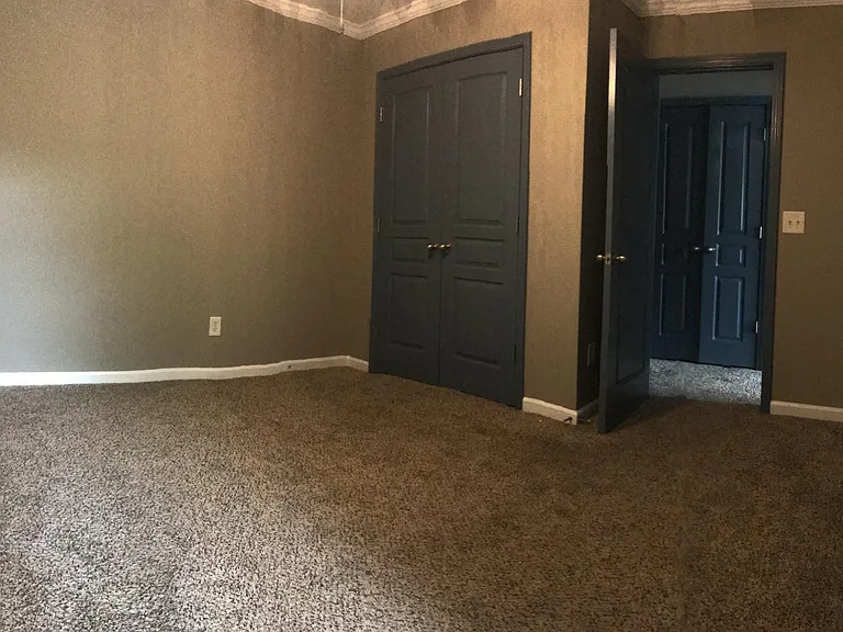 secondary bedroom with one window.

jack & jill bathroom (from where I'm standing) (double doors) closet (open) door to hallway. across from laundry room