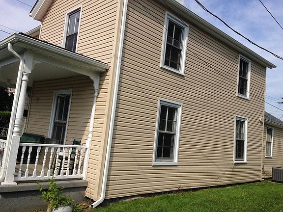 Side of home with havac unit.