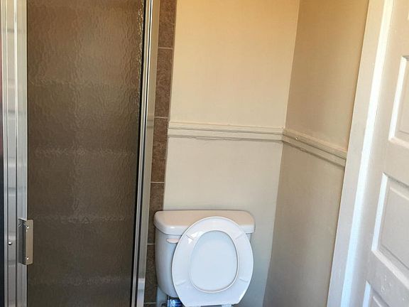 Typical Bathroom with Corner Shower