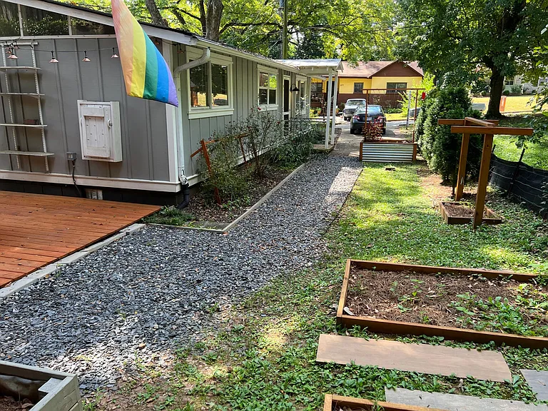Gravel walking path to backyard.