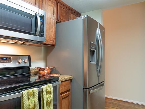 Another view of the kitchen which includes new appliances.
