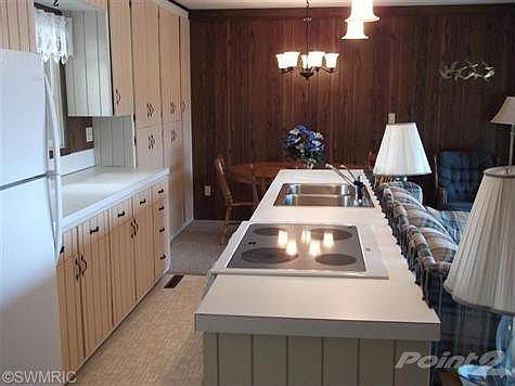 Kitchen with stove, sink, and dishwasher in island