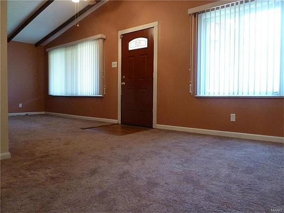 From the living room you step into the dining room separated by the entry area.