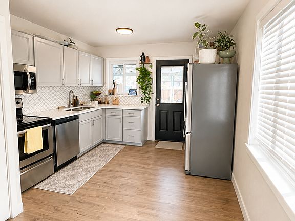 Kitchen with additional storage pantry on the other side of the fridge