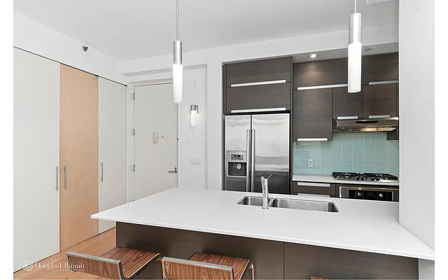 Sold by Douglas Elliman | media 13