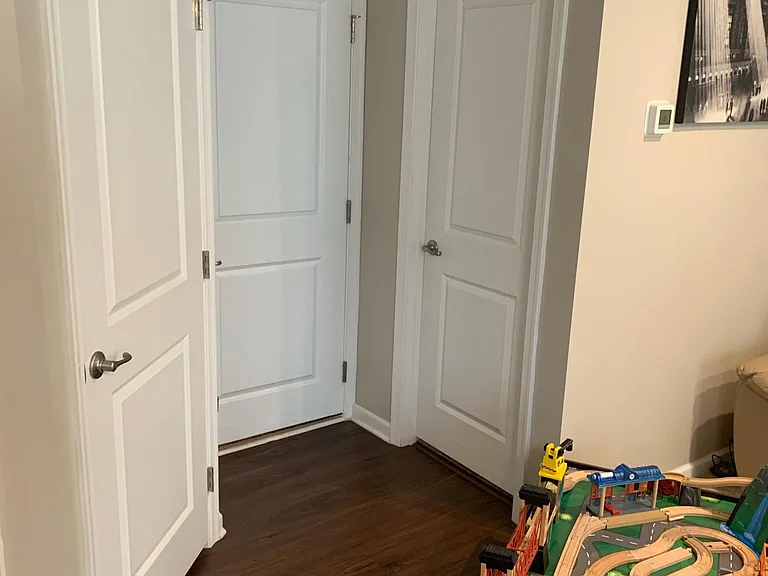 First floor garage entry door and two storage closets