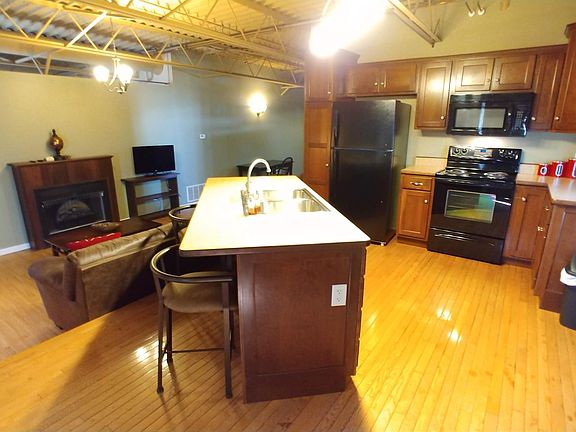 raised platform kitchen overlooks the living area